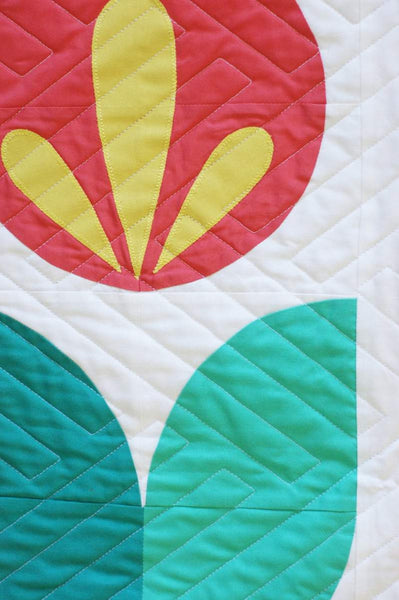 Marigold by Pen + Paper Patterns  This delightful quilt can be customized to go along with your favorite season or favorite colors.  Baby, Throw, and Twin sizes included.