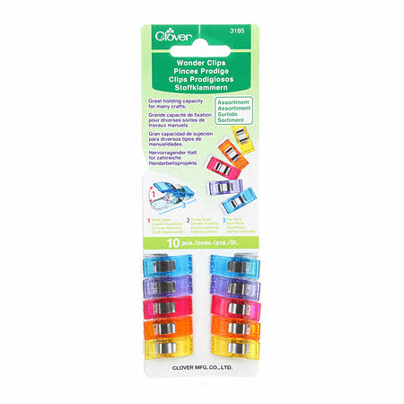 An assortment of colors for an assortment of uses.  Since their introduction primarily for seam binding on quilts, they have been adopted by crafters, beaders, scrapbookers, card makers and every craft where a third hand is needed to hold something down, together or in place. They make a great gift for any crafter or home sewer.